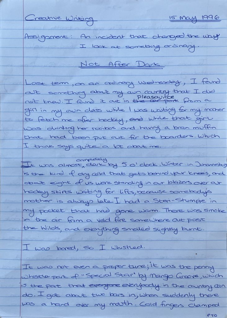 Page one of “Not After Dark”, handwritten in blue ink on lined paper and dated 15 May 1996. The assignment is written across the top: an incident that changed the way I look at something ordinary. The title is double-underlined. “Pleasaunce” has been written in above “the car park”, which is struck through. The page ends mid-sentence with a hand over the writer’s mouth.