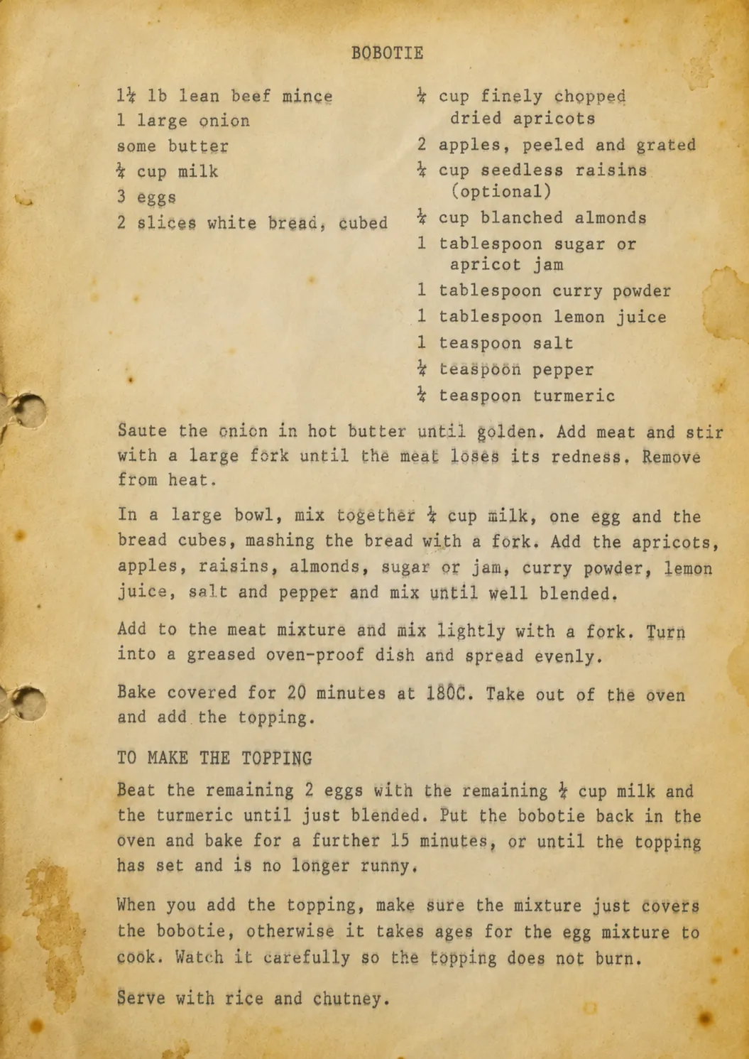 A typewritten bobotie recipe on a page browned with age and marked with cooking stains, from a family cookbook.