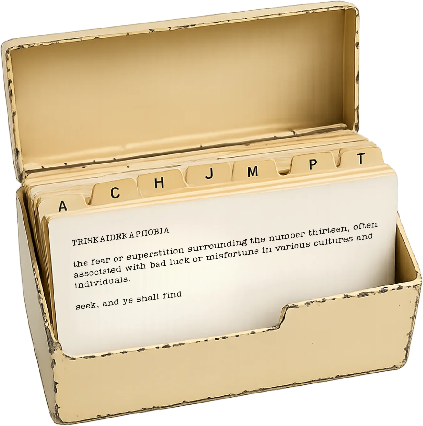 A worn cream metal card-index box, open, with alphabetical tabs and a typed card at the front defining triskaidekaphobia: the fear or superstition surrounding the number thirteen.